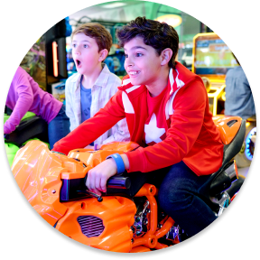 Kid's enjoying the arcade games at birthday party