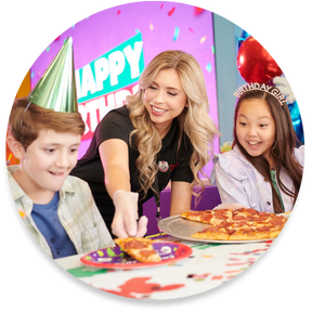 A table setup for kids' birthday parties at Chuck E. Cheese.