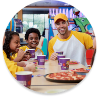 A kids sports team doing team building at Chuck E. Cheese group event